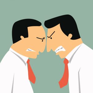 Two angry businessmen head butting in business concept in conflict and confrontation.